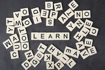 A word Study formed with plastic letter tiles