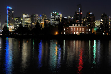 Fototapeta na wymiar Vancouver skyline and Deadmans Island reflected in Coal Harbour from Stanley Park