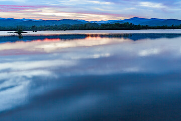 Obraz premium mountains of the Blue Ridge reflect in Lake Wilson after heavy rain