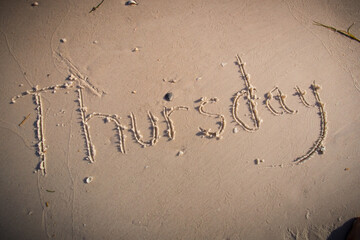 Thursday written on beach sand-2.CR2