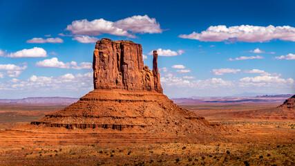 The towering red sandstone formation of West Mitten Butte in the Navajo Nation's Monument Valley Navajo Tribal Park on the border of Arizona and Utah, United States © hpbfotos