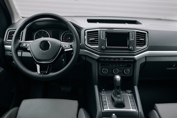 Modern suv car interior with leather panel, multimedia and dashboard © UnPinky