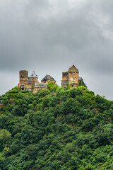 Fototapeta premium The Schonburg Castle is on a hill above the Rhine River and the village of Oberwesel