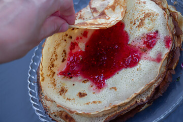 pancakes with raspberry jam. close up.