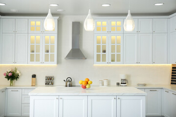 Elegant interior of new kitchen with stylish furniture