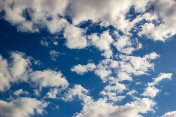 Obraz premium White clouds on the blue sky. Clean air. Empty spase for text.