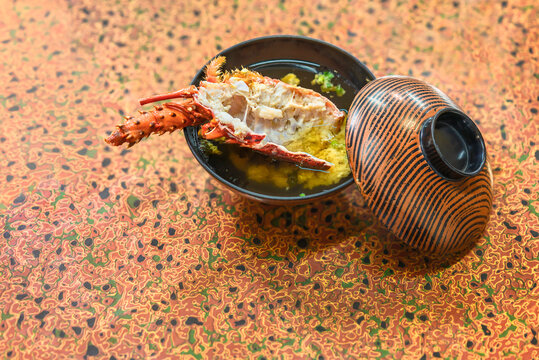 Japanese Misoshiru soup with miso paste and a dashijiru bouillon of a head of Ise-ebi spiny lobster in a owan bowl.