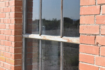 broken window on a brick wall
