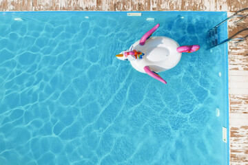 Swimming pool with inflatable ring, top view. Space for text