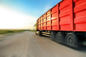 Logistics concept. Truck on country road, motion blur effect