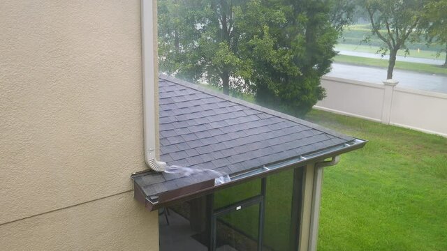 Rain water flowing to gutter of a house	
