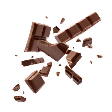 Milk chocolate explosion, pieces shattering on white background