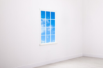 Beautiful view on blue sky with clouds through window in room