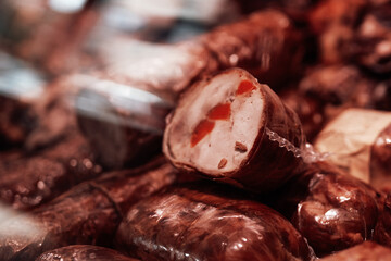 Close up of smoked brown meat. Fresh and deli product. Meat shop business.