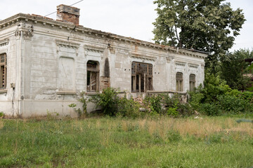 Old house with a unique design in baroque style in Romania abandoned and allowed to grow grass 