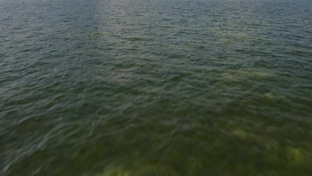 4K aerial of the high-rise buildings at the bay&rsquo;s frontline. Modern skyscrapers in the residential area of ​​the city on a sunny day. Beautiful water view from the Miami Downtown, 4K, Florida, USA