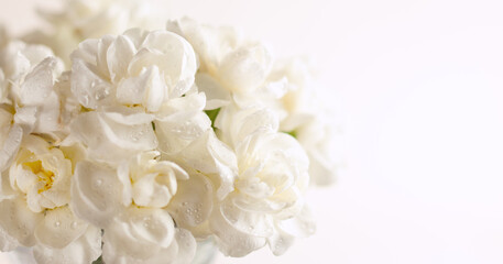 Obraz na płótnie Canvas Floral composition made of beautiful white flowers on light backdrop. Floristic decoration. Natural floral background with carnations.