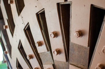 Architecture of a building, the details of the house are built with star-shaped elements to create a vault with lamellar wood beams and assembled with steel brackets, screws and bolts.