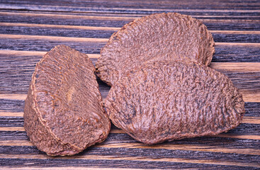 Paranuts vegetarian food in wooden bowls, on old wooden background