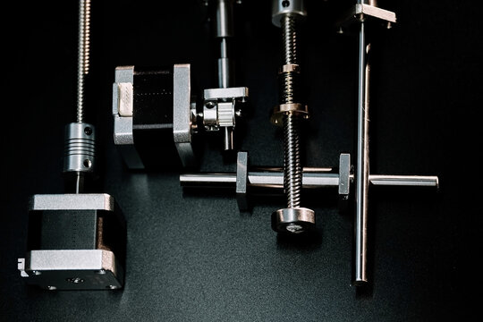 motor and guides for the laser machine. details of the engraving machine, black background
