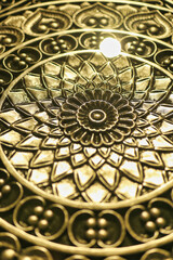 golden closeup on a floral classical pattern metalwork retro art piece