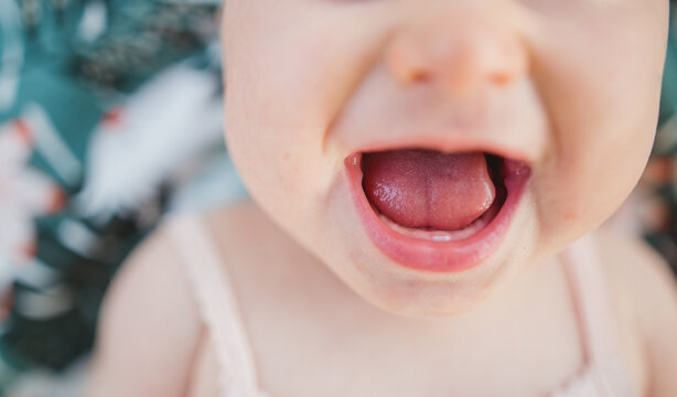 6 Months Old Baby Smiling With A First Tooth Visible, Happy Baby Smile