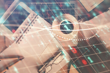 Double exposure of forex chart hologram over desktop with phone. Top view. Mobile trade platform concept.