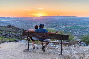 Acrylglasbilder Arizona An interracial couple watches the sun go down from South Mountain in Phoenix, Arizona.  © Gregory E. Clifford
