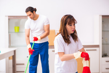 Young pair doing housework at home