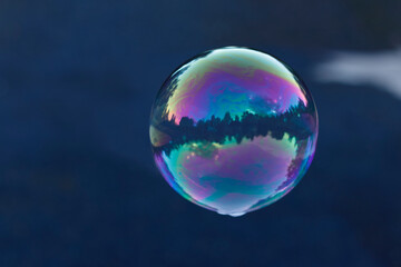 Close up of flying soap bubble,the iridescent effect of soap bubbles.
