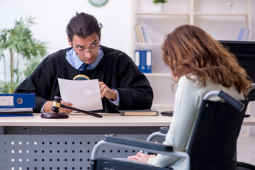 Injured woman and male judge in the courtroom