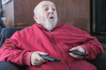 old man mesmerized by cable tv