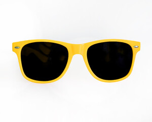 Yellow sunglasses on white background