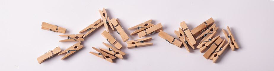 Wooden paper clips on a white background