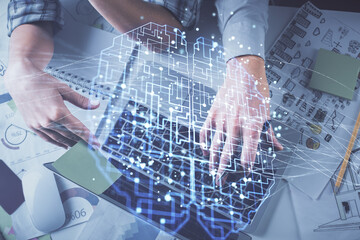 Double exposure of man and woman working together and human brain hologram drawing. Brainstorm concept. Computer background. Top View.