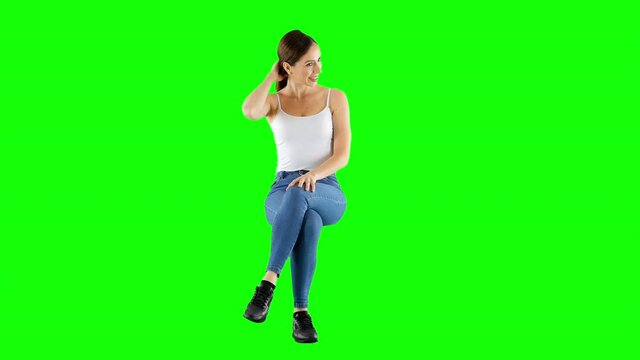 Happy Young Girl Sitting And Waving Her Hand Green Screen