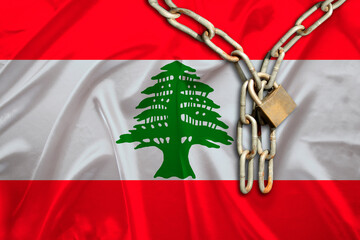 iron chain, a symbol of bondage,protest against the background of national flag Lebanon, the...
