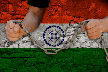 male hands break the iron chain, a symbol of bondage,protest against the background of the national...