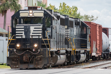 Diesel train engine on tracks in downtown Fernandina Beach Florida. 