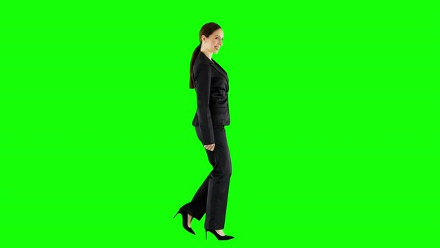 Smiling Business Woman Walking and Looking Around Green Screen
