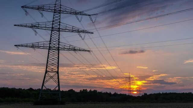 Power Line Timelapse with beautiful Sundown Zoom Out