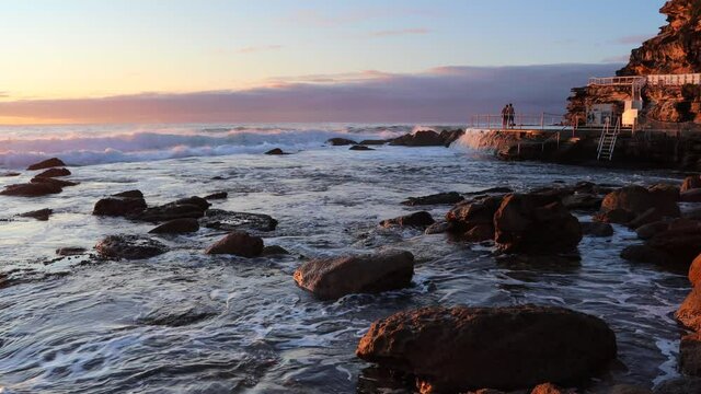 Swimmers jumping to rock pool on Bronte beach in Sydney, Australia &ndash; 4k.
