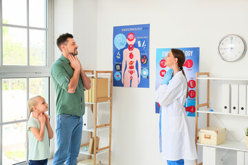Obraz premium Father with daughter visiting endocrinologist in clinic