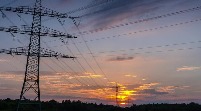 Power Line Timelapse with beautiful Sundown Pan Left