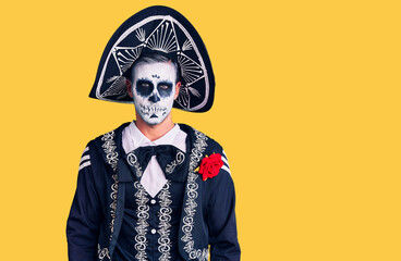 Young man wearing day of the dead costume over background depressed and worry for distress, crying angry and afraid. sad expression.