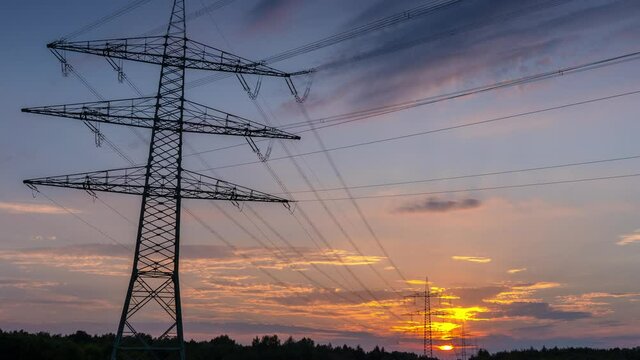 Power Line Timelapse with beautiful Sundown Pan Down