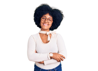 Young african american girl wearing casual clothes and glasses happy face smiling with crossed arms looking at the camera. positive person.