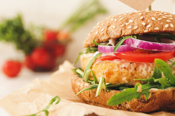 Tasty vegan burger on table, closeup