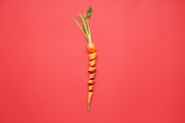 Cut fresh carrot on color background