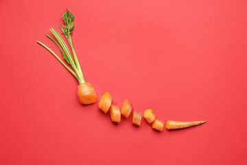 Cut fresh carrot on color background
